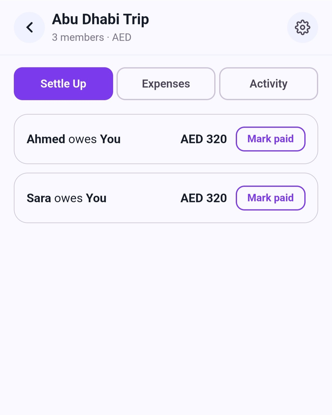 Split tab showing an auto-computed settle-up: two people each owe their share of a shared hotel expense